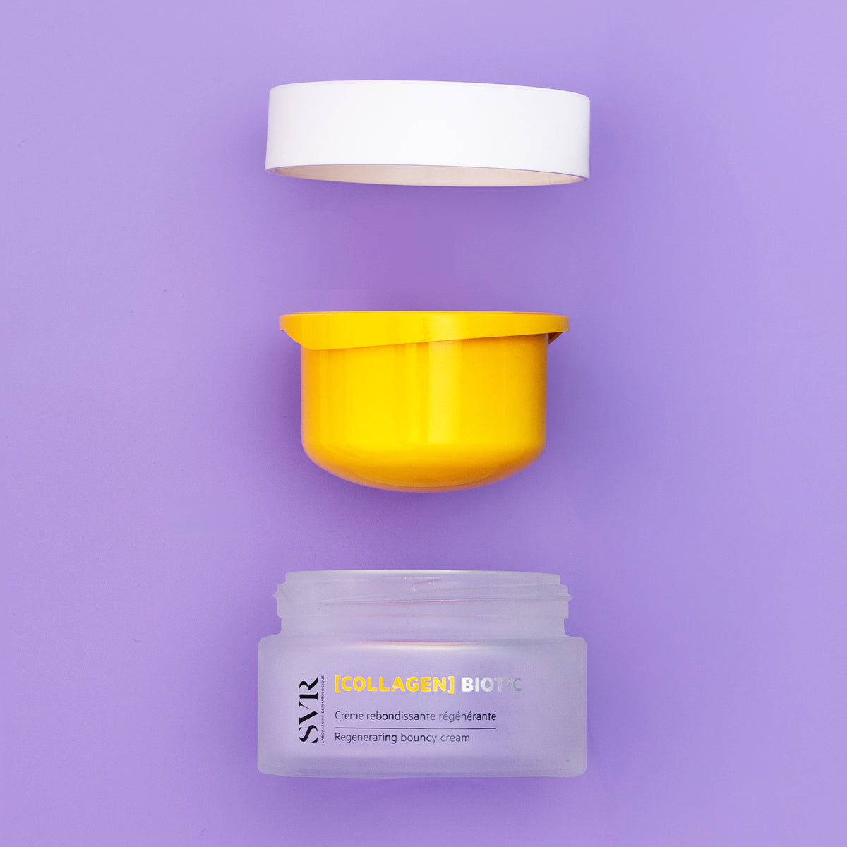 SVR Collagen Biotic cream jar with a yellow inner lid and white cap, displayed disassembled on a soft purple background.