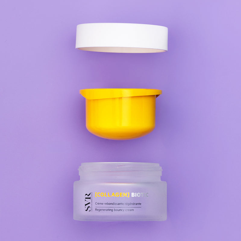 SVR Collagen Biotic cream jar with a yellow inner lid and white cap, displayed disassembled on a soft purple background.